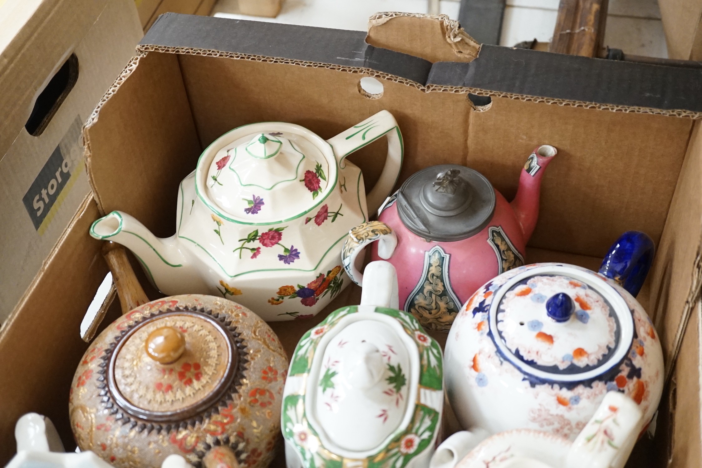 A quantity of various teapots including Doulton, Sadler etc.